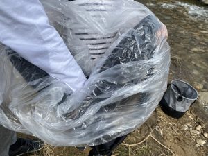 Double-layered plastic bag in a backpack.
